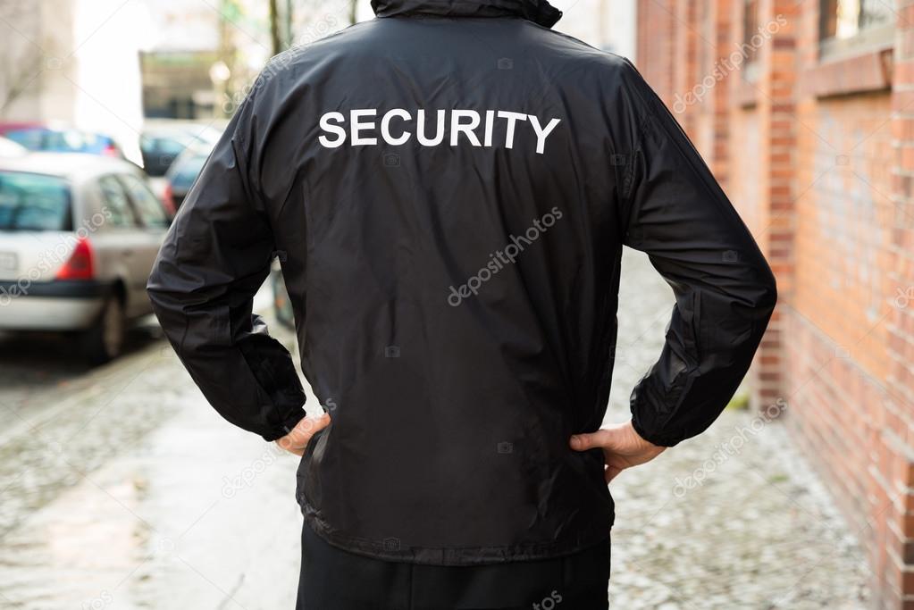 Security Guard Wearing Jacket Stock Photo by ©AndreyPopov 80379990